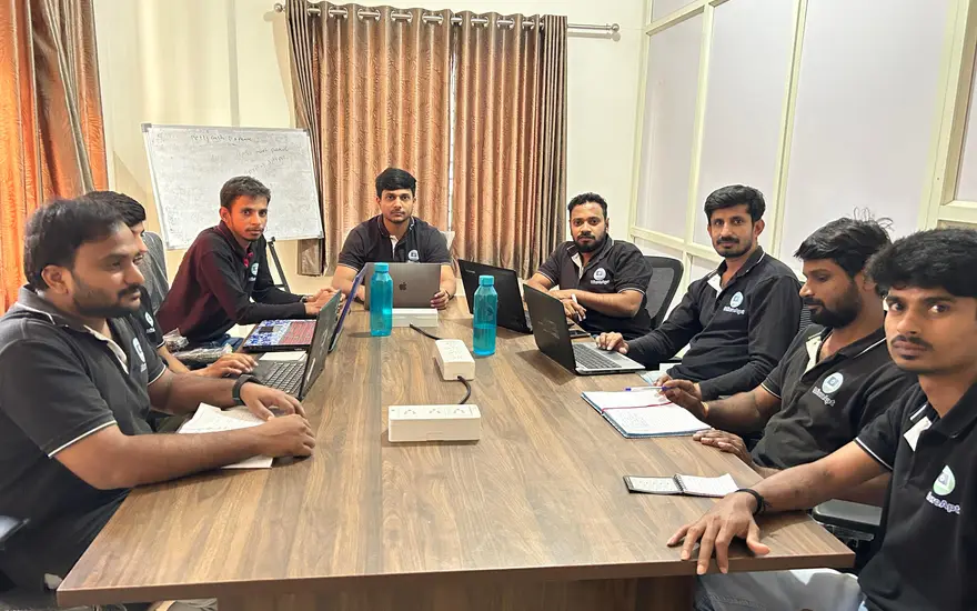 The MicroApts team together at the office.